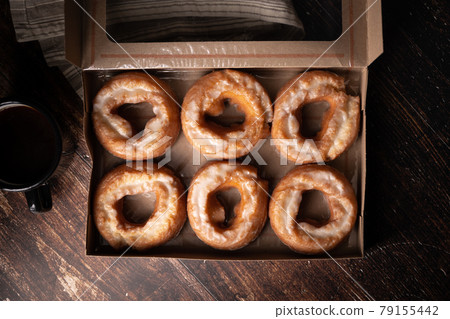 glazed old fashioned style doughnut on dark background 79155442