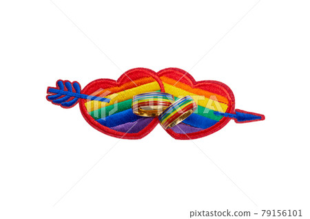 Love wins concept with a multicolored heart and wedding rings. Equality and love protection Love wins concept with a multicolored heart and wedding rings. Equality and love protection 79156101