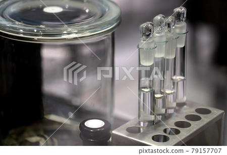 glass test tubes and jars in the lab. concept of medicine and science glass test tubes and jars in the lab. concept of medicine and science 79157707