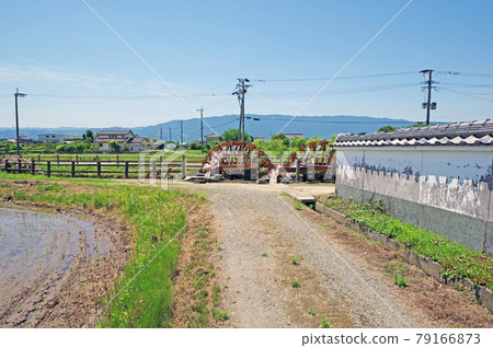 Popular sightseeing spot Hisashige double water wheel in the countryside of Asakura city 79166873