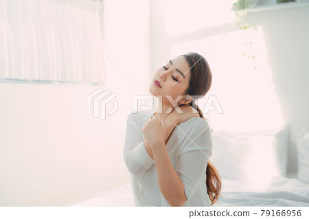 Beautiful asian woman in bedroom morning portrait 79166956