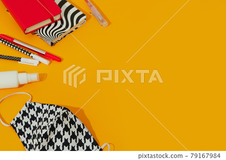 Stationery Mask and Hand Sanitizer Against Orange Table 79167984