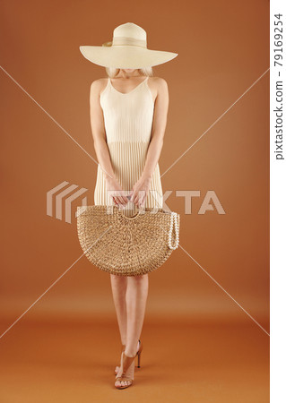 Female Stranger with Straw Bag Female Stranger with Straw Bag 79169254