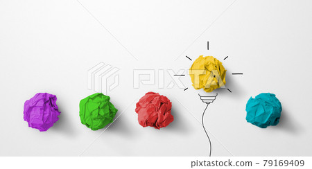 Paper scrap ball yellow colour outstanding different group with light bulb symbol 79169409