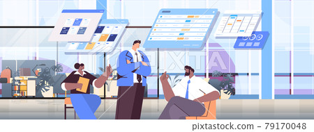 mix race businesspeople team analyzing statistic data on virtual boards successful teamwork concept office interior 79170048