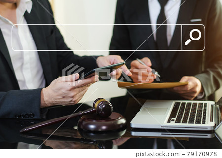 Business and lawyers discussing contract papers with brass scale on desk in office. Law, legal services, advice,  justice and law concept .. 79170978