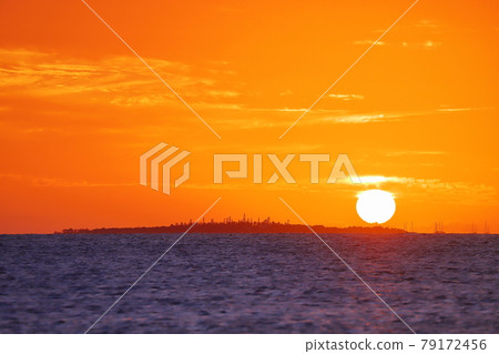Sunset over Mettle Island as seen from the Anse Vata coast near Noumea, the capital of New Caledonia in Melanesia, South Pacific Sunset over Mettle Island as seen from the Anse Vata coast near Noumea, the capital of New Caledonia in Melanesia, South Pacific 79172456