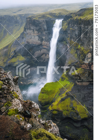 Haifoss waterfall in Iceland - one of the highest waterfall in Iceland, popular tourist destination. Haifoss waterfall in Iceland - one of the highest waterfall in Iceland, popular tourist destination. 79173083