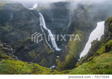 Gorge with Granni waterfall. Waterfall in a narrow gorge in the Thjorsardalur valley in Iceland 79173084