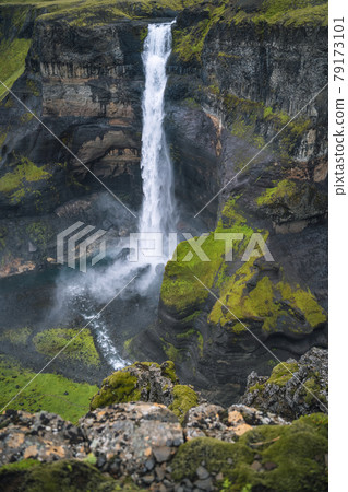 Haifoss waterfall in Iceland - one of the highest waterfall in Iceland, popular tourist destination. Haifoss waterfall in Iceland - one of the highest waterfall in Iceland, popular tourist destination. 79173101