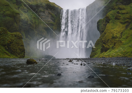 Famous and most visited Skogafoss waterfall in Iceland at evening light Famous and most visited Skogafoss waterfall in Iceland at evening light 79173103