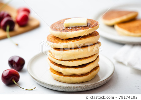 Stack of pancakes with butter 79174192