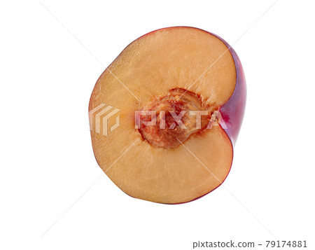 Half of a smooth-skinned, mellow, purple plum fruit with kernel isolated on white background with copy space for text or images. Side view. Close-up. Half of a smooth-skinned, mellow, purple plum fruit with kernel isolated on white background with copy space for text or images. Side view. Close-up. 79174881