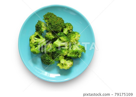 Boiled broccoli in a blue plate isolated on a white background with clipping path. Top view of Vegetables in a dish. Healthy food. Boiled broccoli in a blue plate isolated on a white background with clipping path. Top view of Vegetables in a dish. Healthy food. 79175109