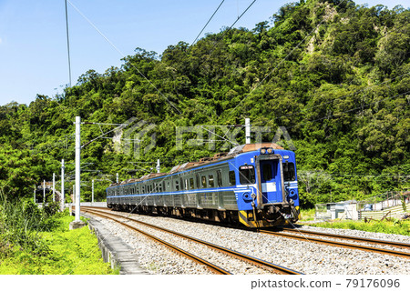 Fast local train through the beautiful countryside of Hualien, Taiwan 79176096