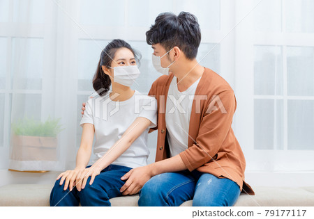 Man taking care of sick family member 79177117