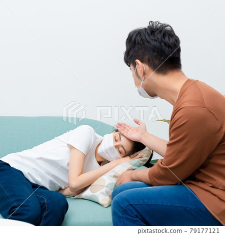 Man taking care of sick family member Man taking care of sick family member 79177121