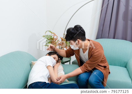 Man taking care of sick family member 79177125