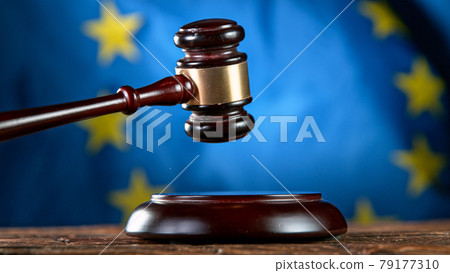 Gavel being struck to decide an auction or guilty verdict in court. 79177310