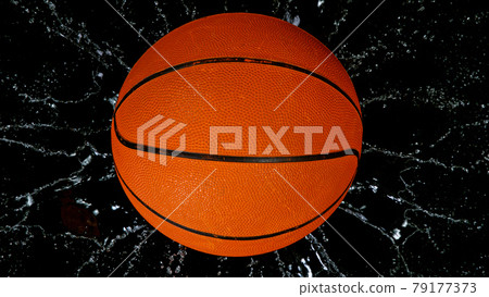 Falling basketball ball on water surface, black background. Falling basketball ball on water surface, black background. 79177373