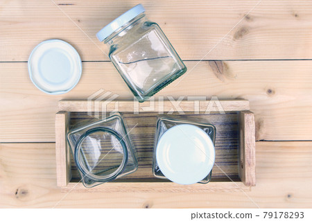 Empty jar on wood table background Empty jar on wood table background 79178293
