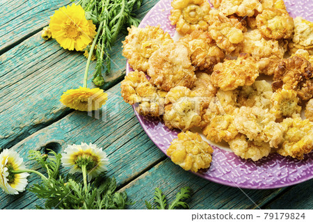 Chrysanthemum flowers in batter Chrysanthemum flowers in batter 79179824