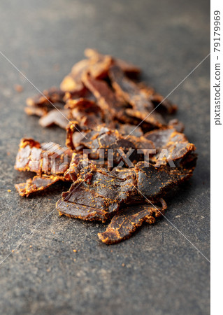 Sliced beef jerky. Dried beef meat. 79179969