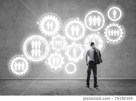 Cogwheel engine drawn on concrete wall as symbol for teamwork an Cogwheel engine drawn on concrete wall as symbol for teamwork an 79180304