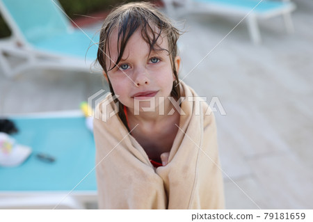 Little frozen girl in towel after bathing closeup Little frozen girl in towel after bathing closeup 79181659