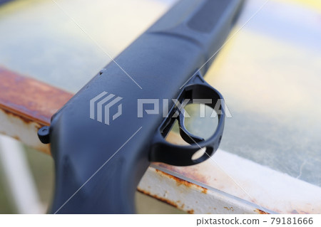 black firearm with trigger lies on table closeup 79181666