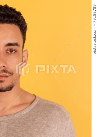 Young male portrait isolated on studio background with copyspace for ad. Flyer. Cropped image Young male portrait isolated on studio background with copyspace for ad. Flyer. Cropped image 79182789