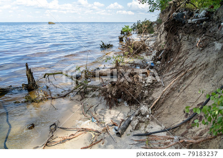 Environmental problem caused by human activity. Trash tourism. Pollution of Kiev Sea in Ukraine. Plastic garbage on shore of pond. Rubbish and waste left by bad people after vacation on dnieper river Environmental problem caused by human activity. Trash tourism. Pollution of Kiev Sea in Ukraine. Plastic garbage on shore of pond. Rubbish and waste left by bad people after vacation on dnieper river 79183237