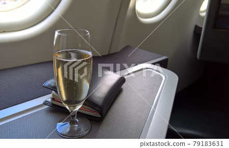 Welcome drink and Travel Document on Business class cabin, Welcome drink serve when passenger boarding. 79183631