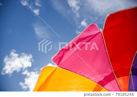 Summer sky and parasol Summer sky and parasol 79185248