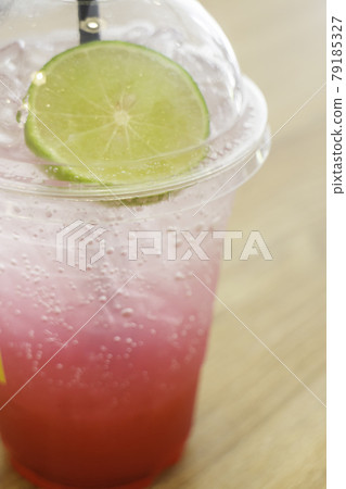 Refreshing soda water with lime in glass Refreshing soda water with lime in glass 79185327