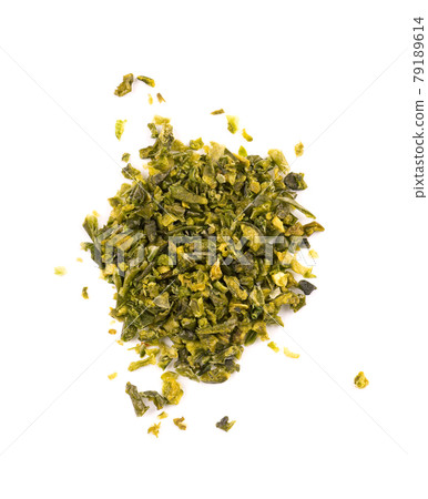 Dried green paprika flakes with seeds isolated on white background. Chopped jalapeno, habanero or chilli pepper. Spices and herbs. Top view. 79189614