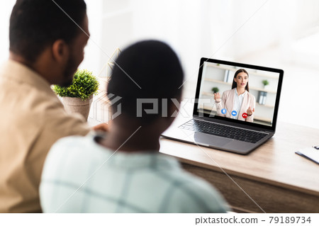 Black Couple Having Video Call Online Consultation With Manager Indoor 79189734