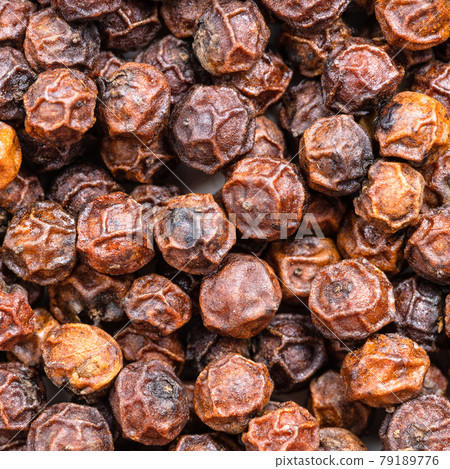 red kampot peppercorns close up 79189776