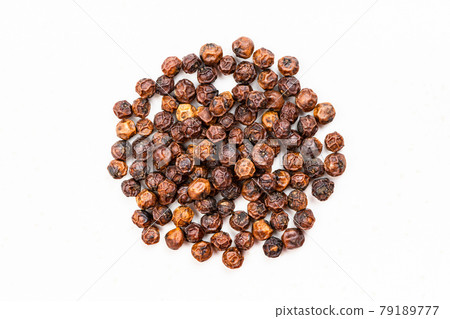 pile of red kampot pepper close up on gray 79189777