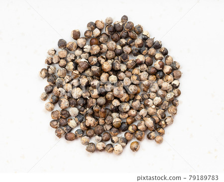 pile of monk's pepper (vitex) close up on gray 79189783