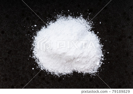 pile of vanillin powder close up on black pile of vanillin powder close up on black 79189829