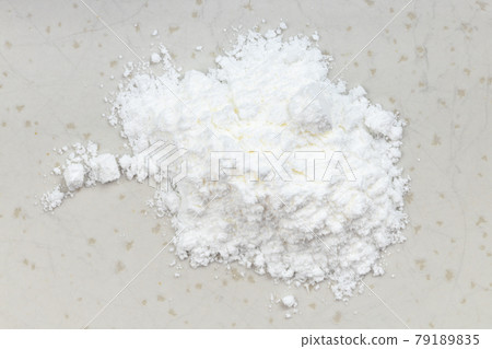 top view of pile of baking powder close up on gray top view of pile of baking powder close up on gray 79189835