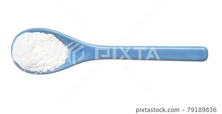 baking powder in ceramic spoon isolated 79189836