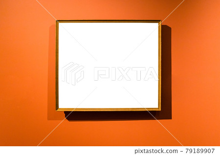 narrow wooden picture frame on orange wall narrow wooden picture frame on orange wall 79189907
