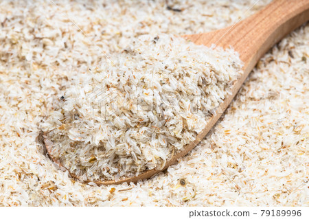 above view of wooden spoon with psyllium husk above view of wooden spoon with psyllium husk 79189996