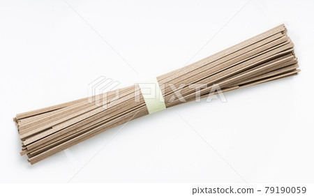bunch of dried flat Soba noodles on white plate bunch of dried flat Soba noodles on white plate 79190059