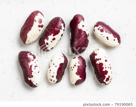 several red speckled kidney beans close up on gray 79190065