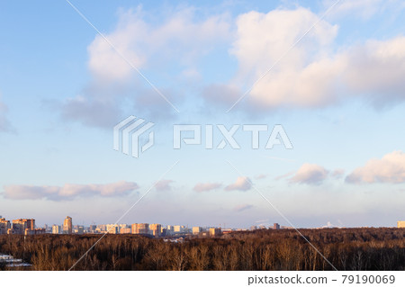 sunset sky with clouds over city park and houses sunset sky with clouds over city park and houses 79190069