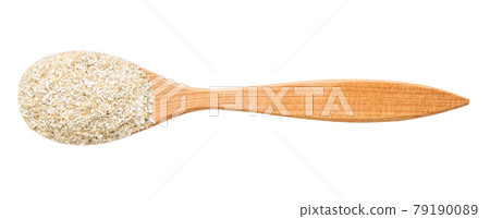 top view of wood spoon with rye bran isolated 79190089