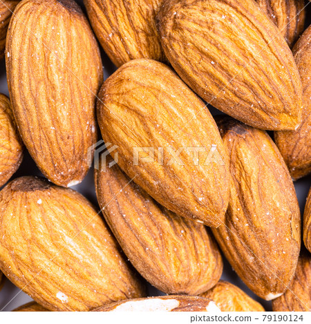 raw almond seeds close up raw almond seeds close up 79190124